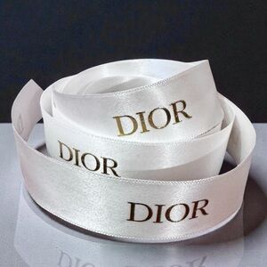 DIOR Satin White Ribbon With Gold Print.
New. 55 Inches.